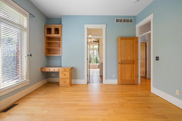2806 Oakmont Ct, Champaign, IL 61821 - unfurnished office featuring light wood-style flooring, a ceiling fan, and baseboards