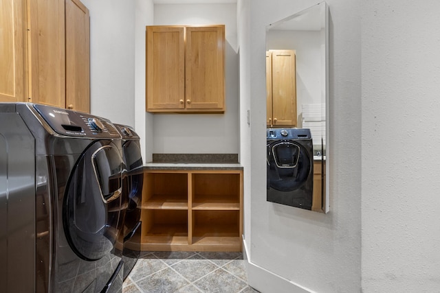 2806 Oakmont Ct, Champaign, IL 61821 - laundry room with cabinet space and washing machine and dryer