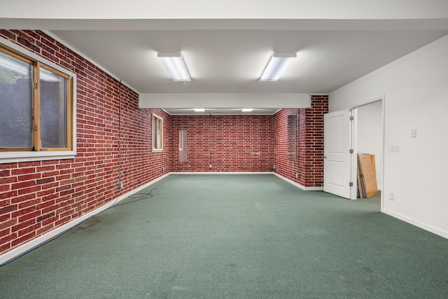 2806 Oakmont Ct, Champaign, IL 61821 - carpeted empty room with brick wall and baseboards