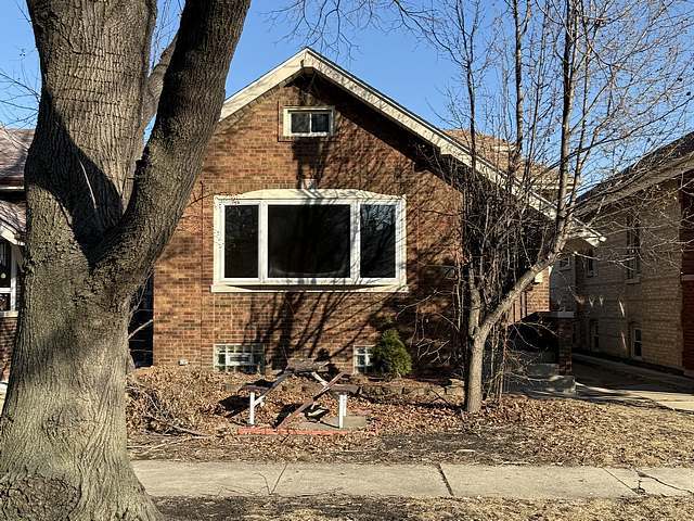 view of property exterior with brick siding