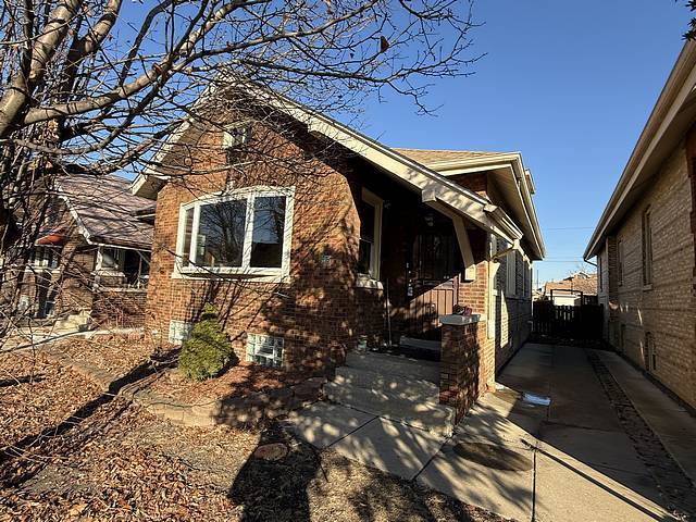 view of home's exterior featuring brick siding