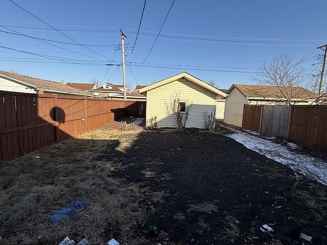 view of yard with a fenced backyard