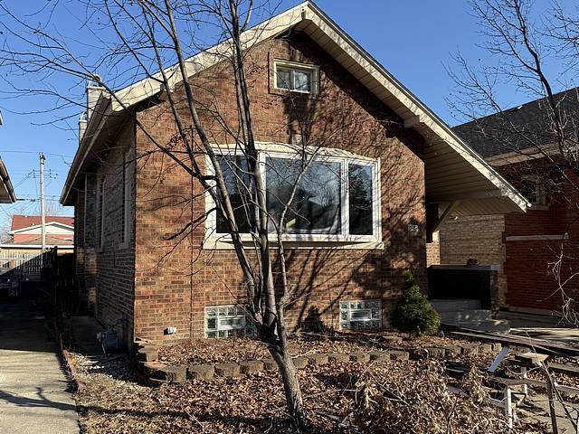 view of home's exterior featuring brick siding