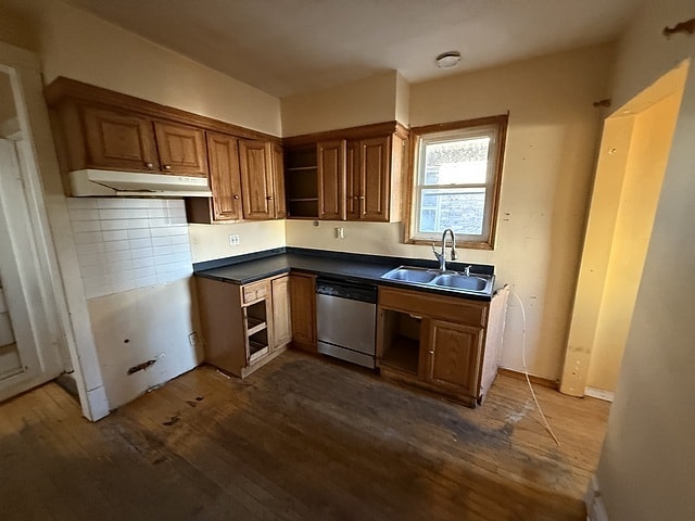 kitchen with dishwasher, dark wood-style flooring, under cabinet range hood, open shelves, and a sink