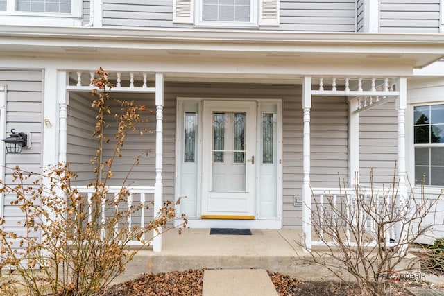 doorway to property with a porch