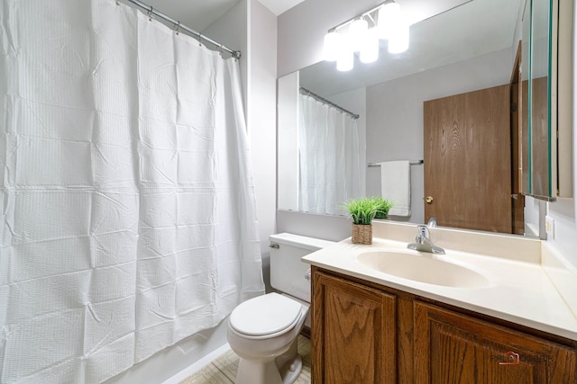 full bath featuring vanity and toilet