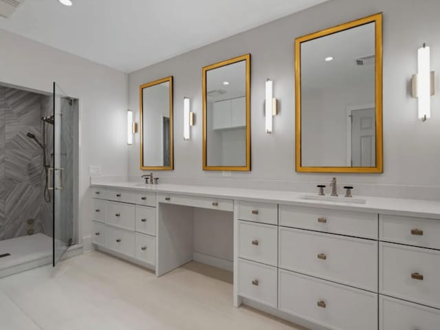 full bath featuring a stall shower, visible vents, and vanity