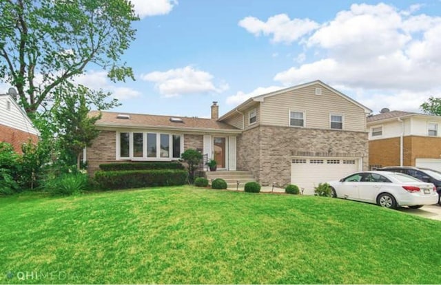 tri-level home with a garage, driveway, a chimney, and a front lawn