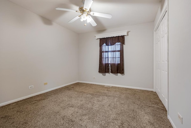 unfurnished bedroom featuring carpet floors, a closet, and baseboards