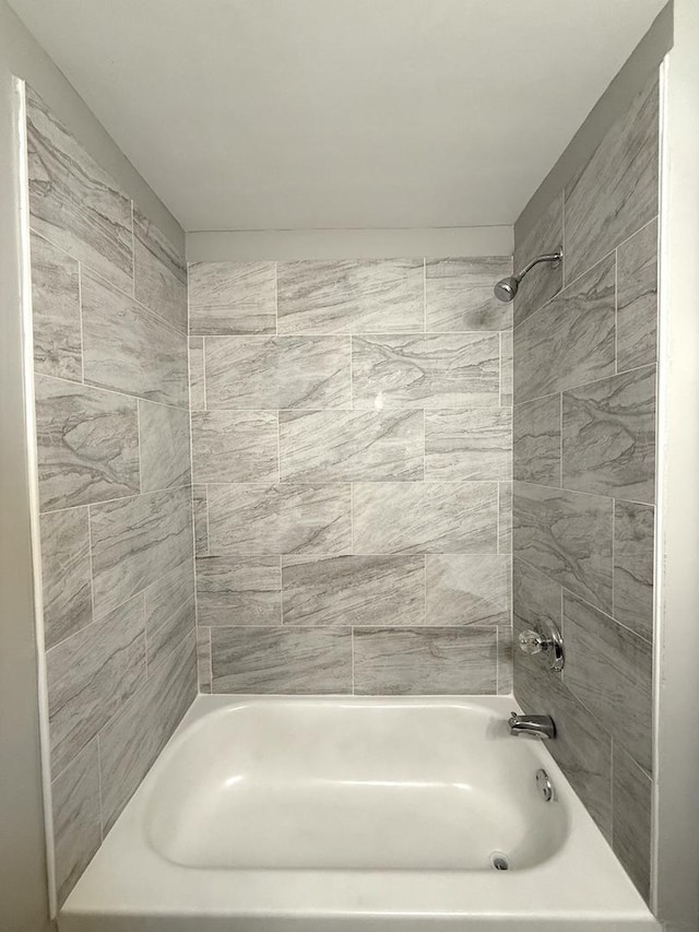 bathroom featuring washtub / shower combination