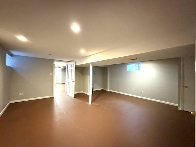 finished below grade area with visible vents, recessed lighting, and baseboards