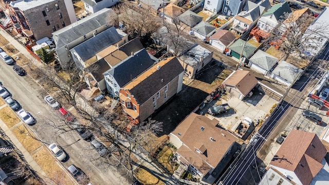 birds eye view of property with a residential view