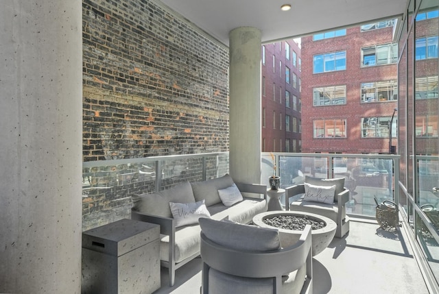 view of patio featuring a balcony and outdoor lounge area