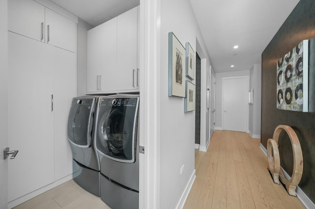 laundry room with recessed lighting, cabinet space, light wood-style flooring, independent washer and dryer, and baseboards