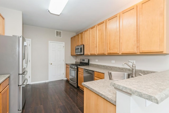87 E Haines Dr Unit 87, Hainesville, IL 60030 - kitchen featuring a sink, light brown cabinets, stainless steel appliances, a peninsula, and visible vents