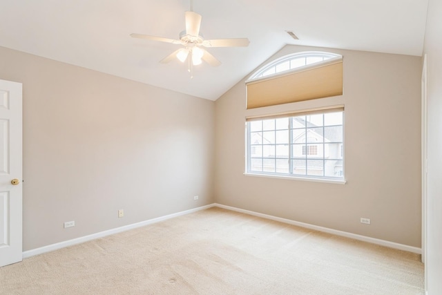 87 E Haines Dr Unit 87, Hainesville, IL 60030 - spare room featuring light colored carpet, ceiling fan, vaulted ceiling, and baseboards