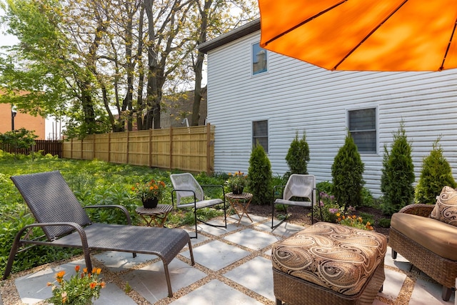 view of patio / terrace featuring fence