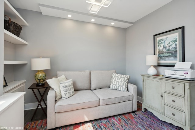 living room featuring recessed lighting, baseboards, and wood finished floors