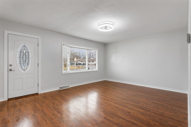 entryway featuring wood finished floors, visible vents, and baseboards