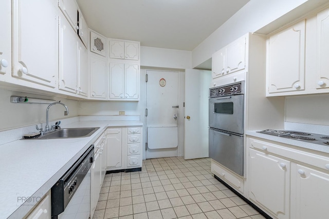 kitchen featuring light countertops, multiple ovens, a sink, and dishwashing machine