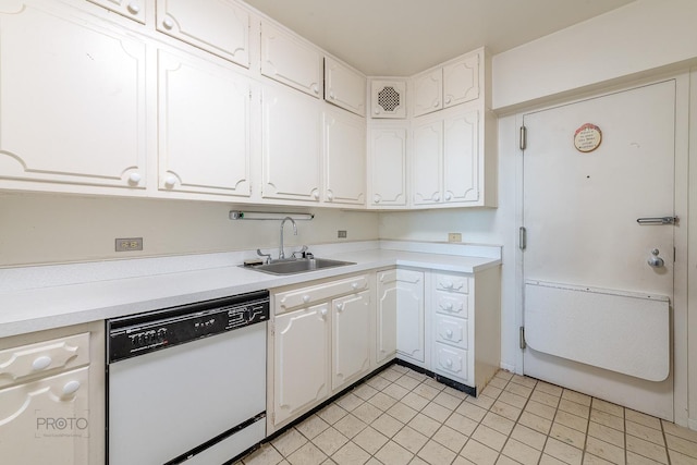 kitchen with dishwasher, a sink, and white cabinetry