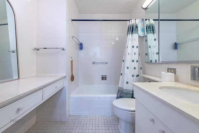 bathroom featuring tile patterned flooring, toilet, vanity, tile walls, and shower / bath combo with shower curtain