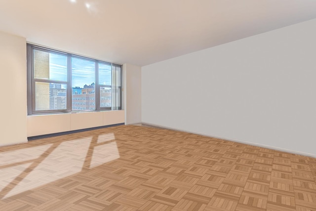 empty room with baseboards