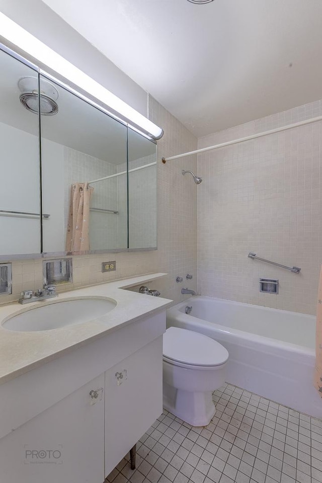 full bath with toilet,  shower combination, tile patterned flooring, vanity, and backsplash