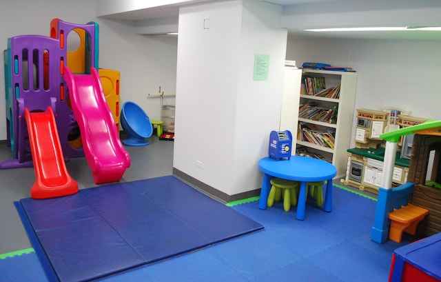 game room with baseboards