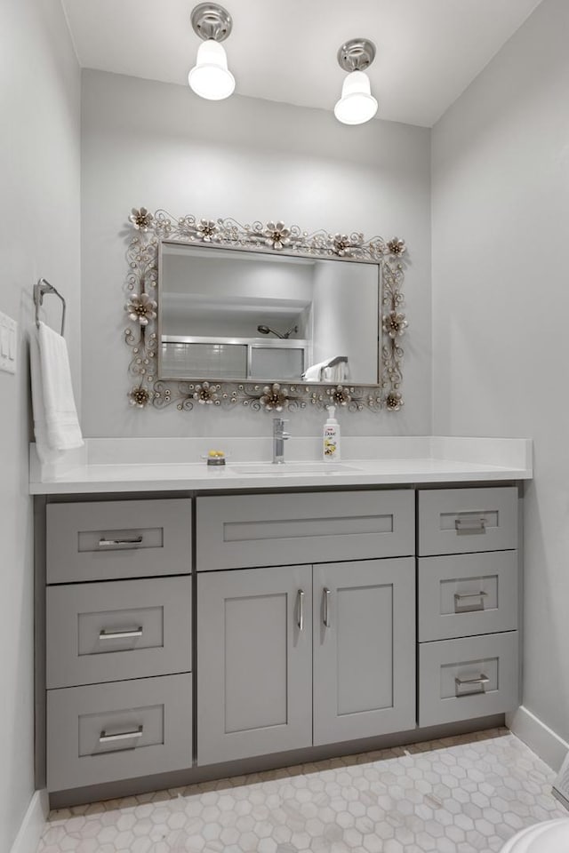 bathroom with baseboards and vanity