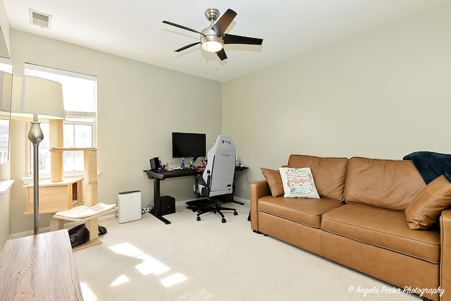 home office featuring a ceiling fan, visible vents, and carpet flooring