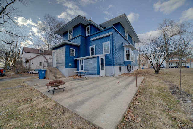 view of front of house with a fire pit