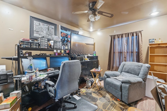 office space featuring a ceiling fan and wood finished floors