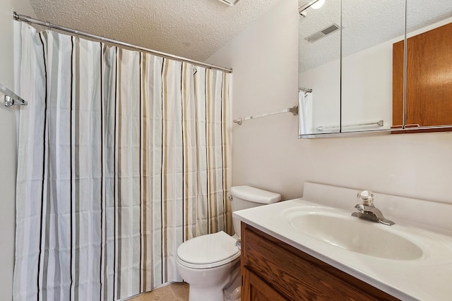 bathroom featuring visible vents, toilet, curtained shower, a textured ceiling, and vanity