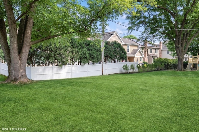 view of yard with fence