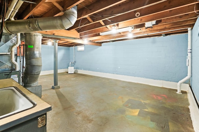 unfinished basement featuring a sink