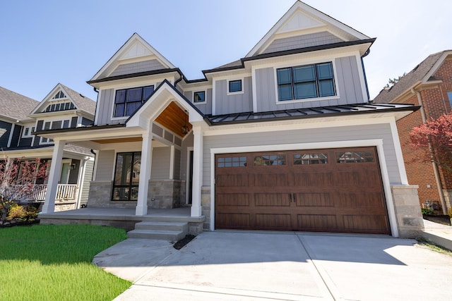591 S Saylor Ave, Elmhurst, IL 60126 - craftsman-style home featuring an attached garage, board and batten siding, a porch, a standing seam roof, and driveway