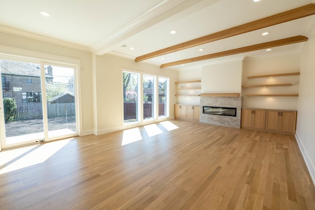 591 S Saylor Ave, Elmhurst, IL 60126 - unfurnished living room featuring plenty of natural light, light wood-style flooring, baseboards, and beamed ceiling