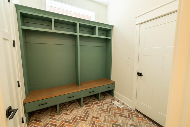 591 S Saylor Ave, Elmhurst, IL 60126 - mudroom with baseboards and brick floor