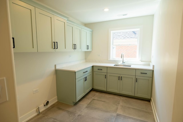 591 S Saylor Ave, Elmhurst, IL 60126 - kitchen featuring visible vents, light tile patterned flooring, baseboards, light countertops, and a sink