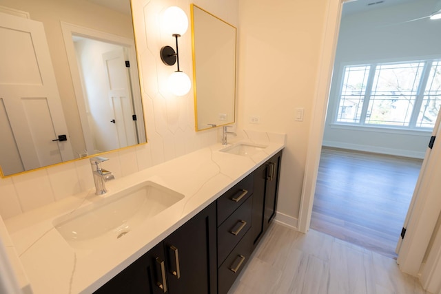 591 S Saylor Ave, Elmhurst, IL 60126 - full bathroom featuring double vanity, baseboards, and a sink