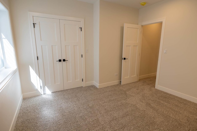 591 S Saylor Ave, Elmhurst, IL 60126 - unfurnished bedroom with carpet flooring, baseboards, and a closet