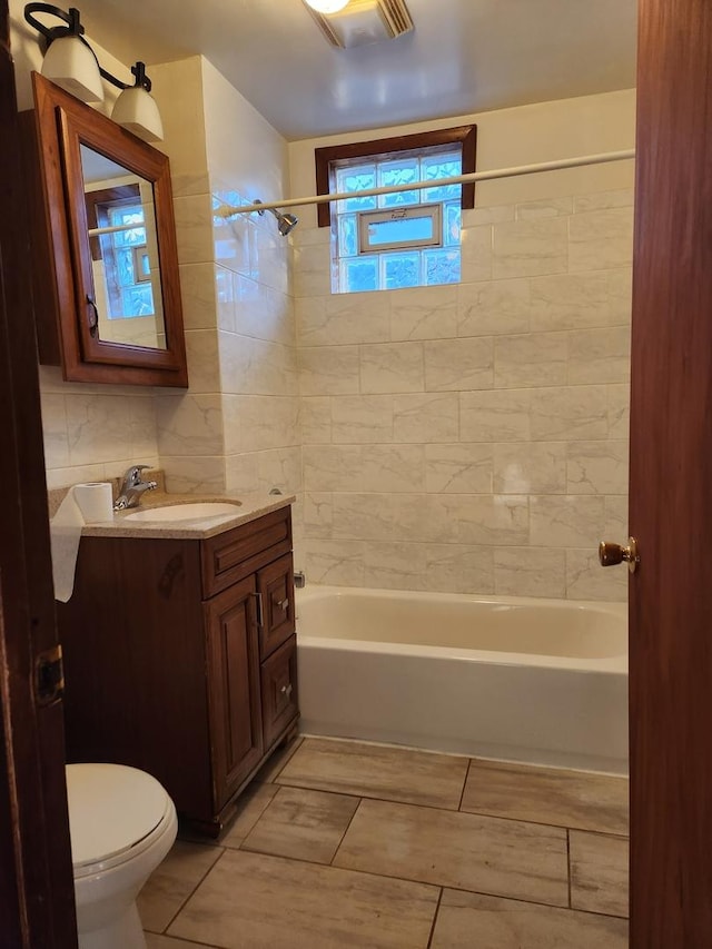 full bath featuring toilet, shower / washtub combination, and vanity