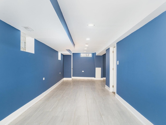 interior space with baseboards, visible vents, and recessed lighting