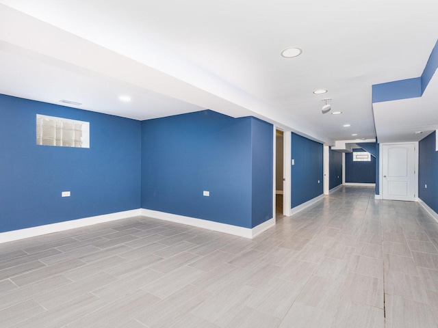 basement with recessed lighting, visible vents, and baseboards