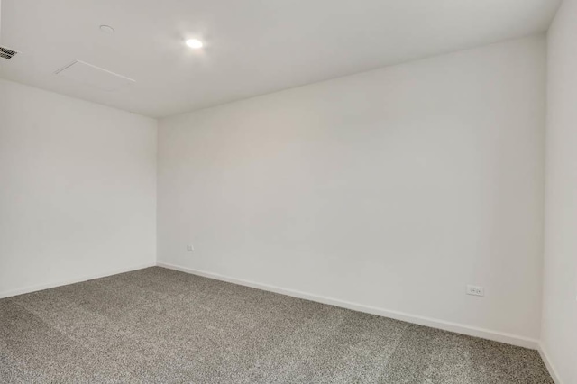 unfurnished room featuring carpet and baseboards