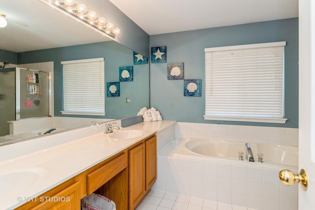 full bathroom featuring a stall shower, a garden tub, a sink, and double vanity