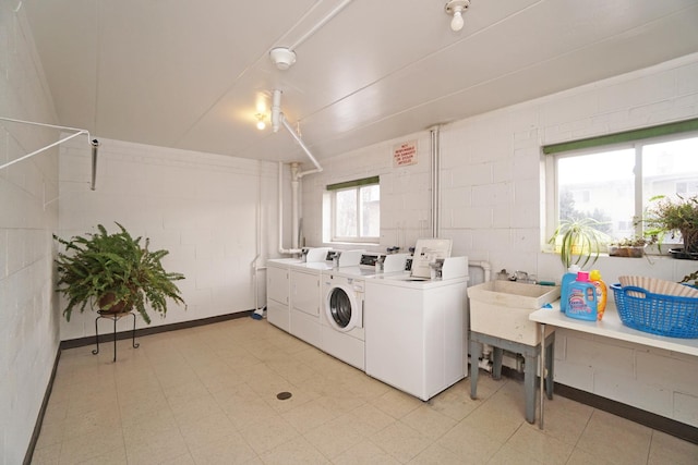 shared laundry area with separate washer and dryer