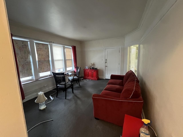 carpeted living area featuring baseboards