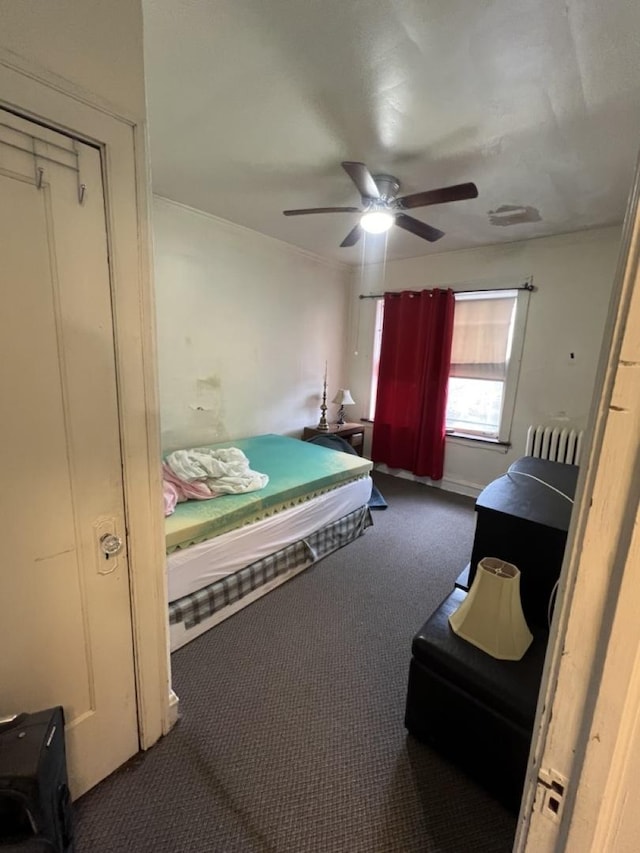 carpeted bedroom with a ceiling fan